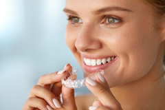 Photo of woman with Invisalign braces